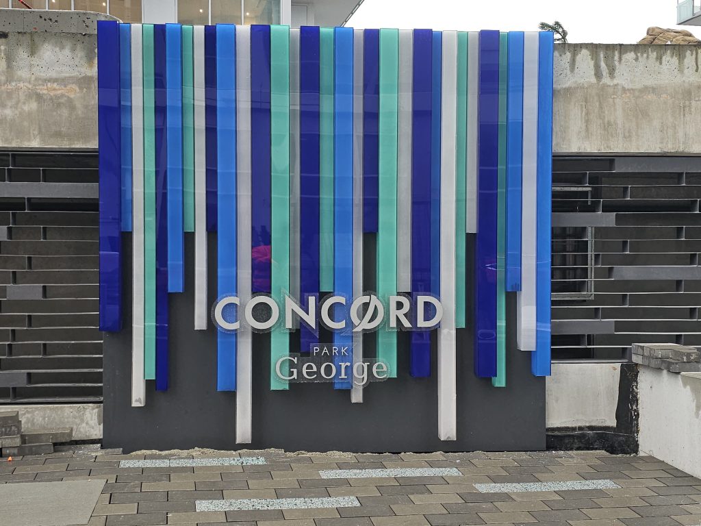 Sign made up of acrylic tubes in vatious lengths/colours to create a 'waterfall' effect